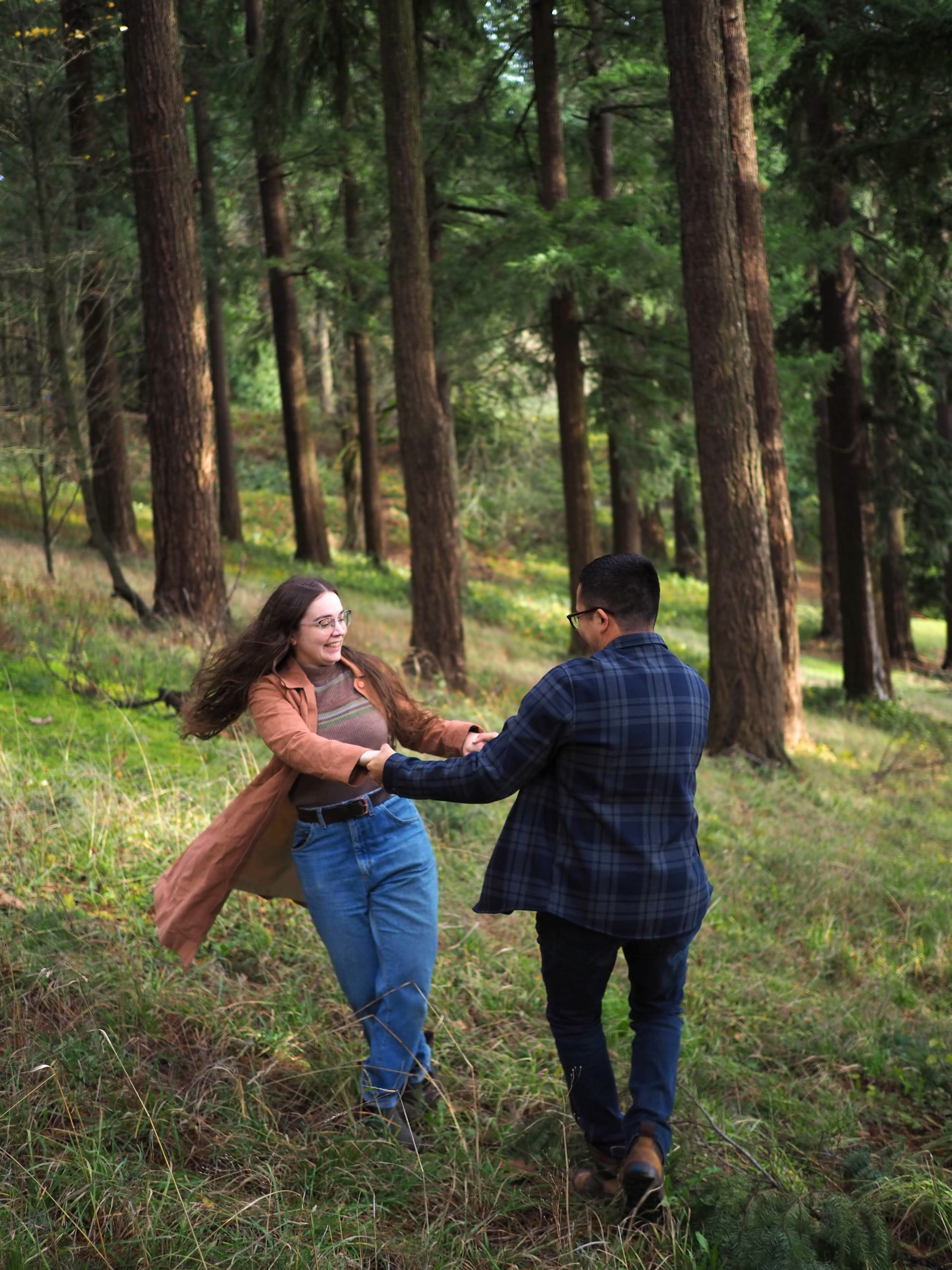 Kaitlin and Dave spinning together during their engagement session