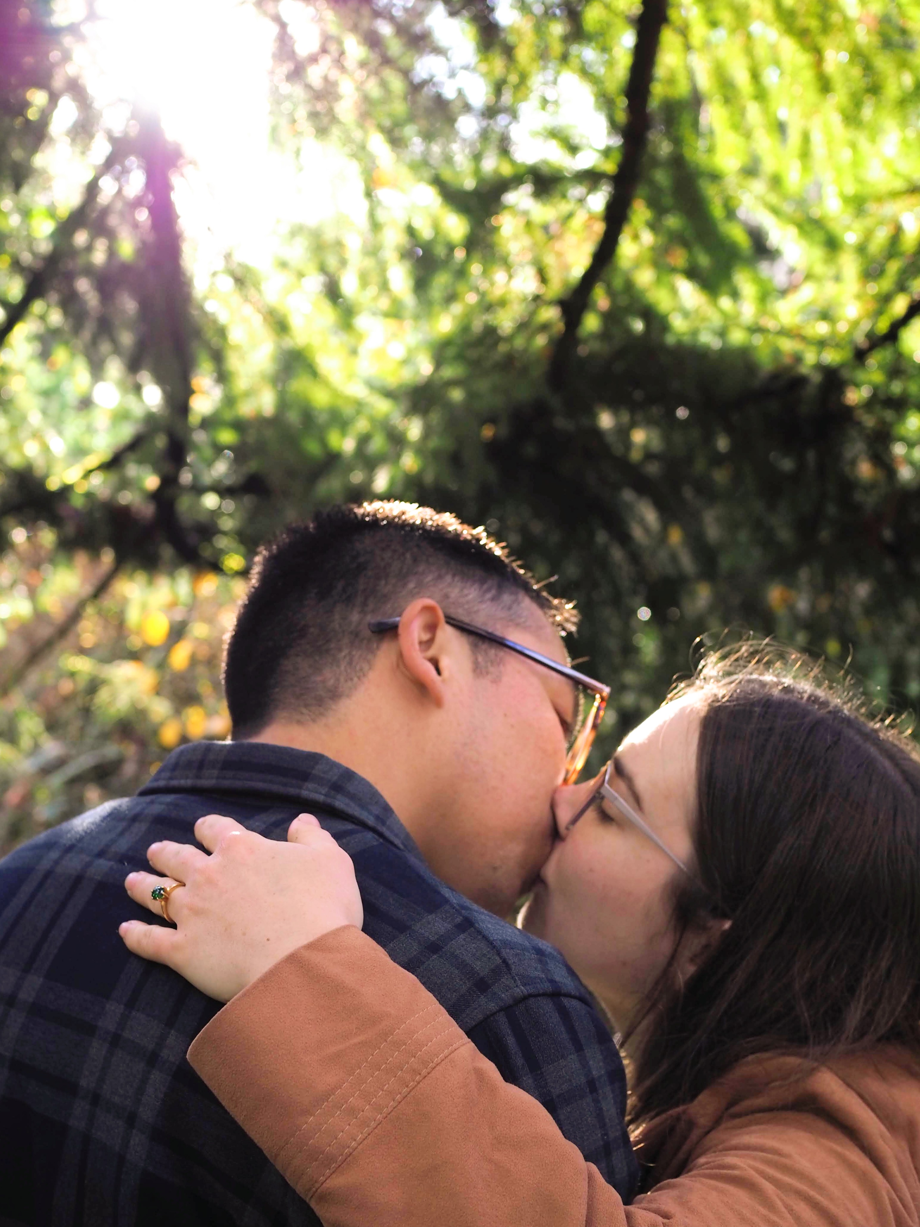 Kaitlin and David sharing a kiss during their engagement session