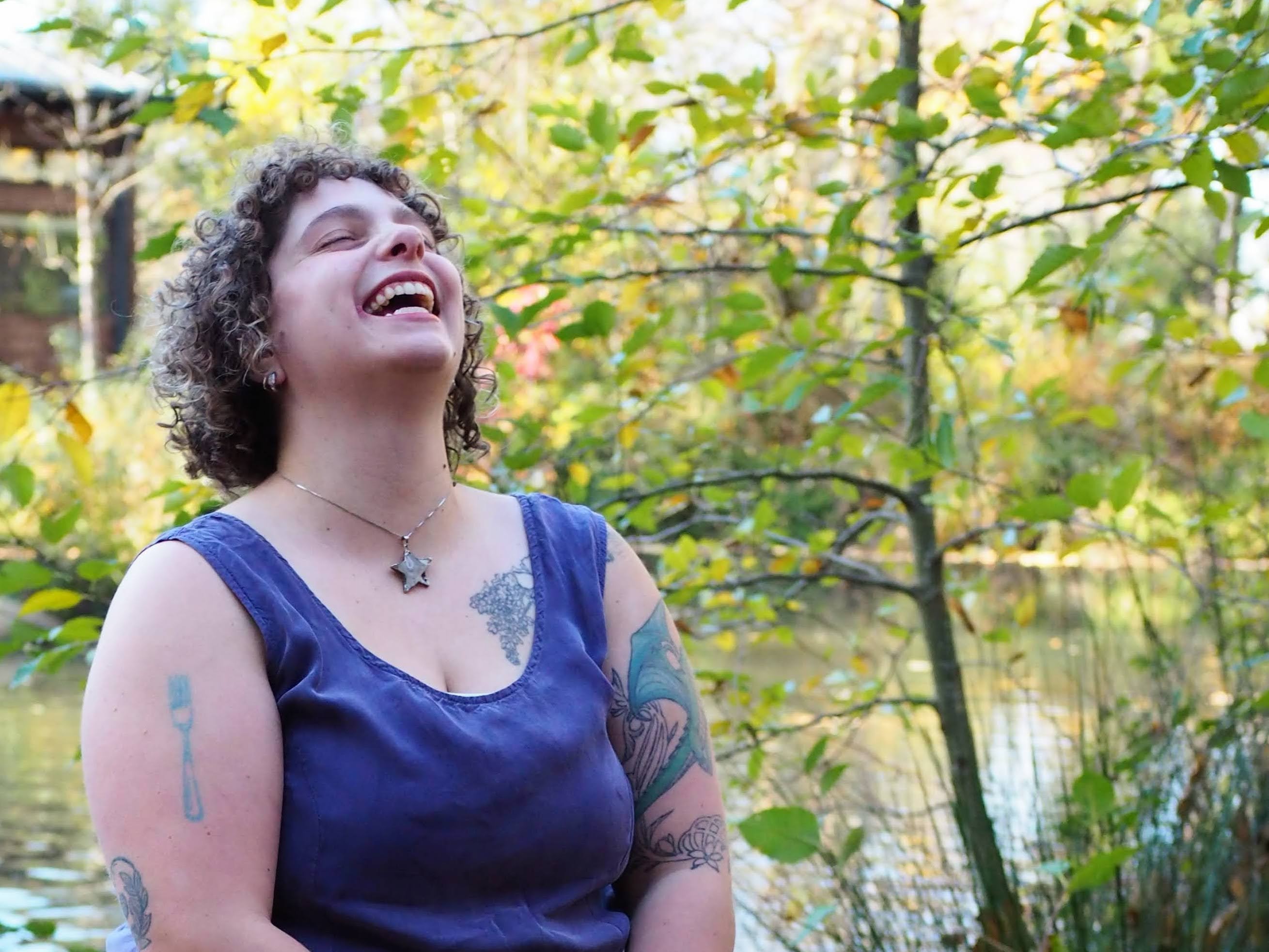 Sasha laughing during an outdoor portrait session