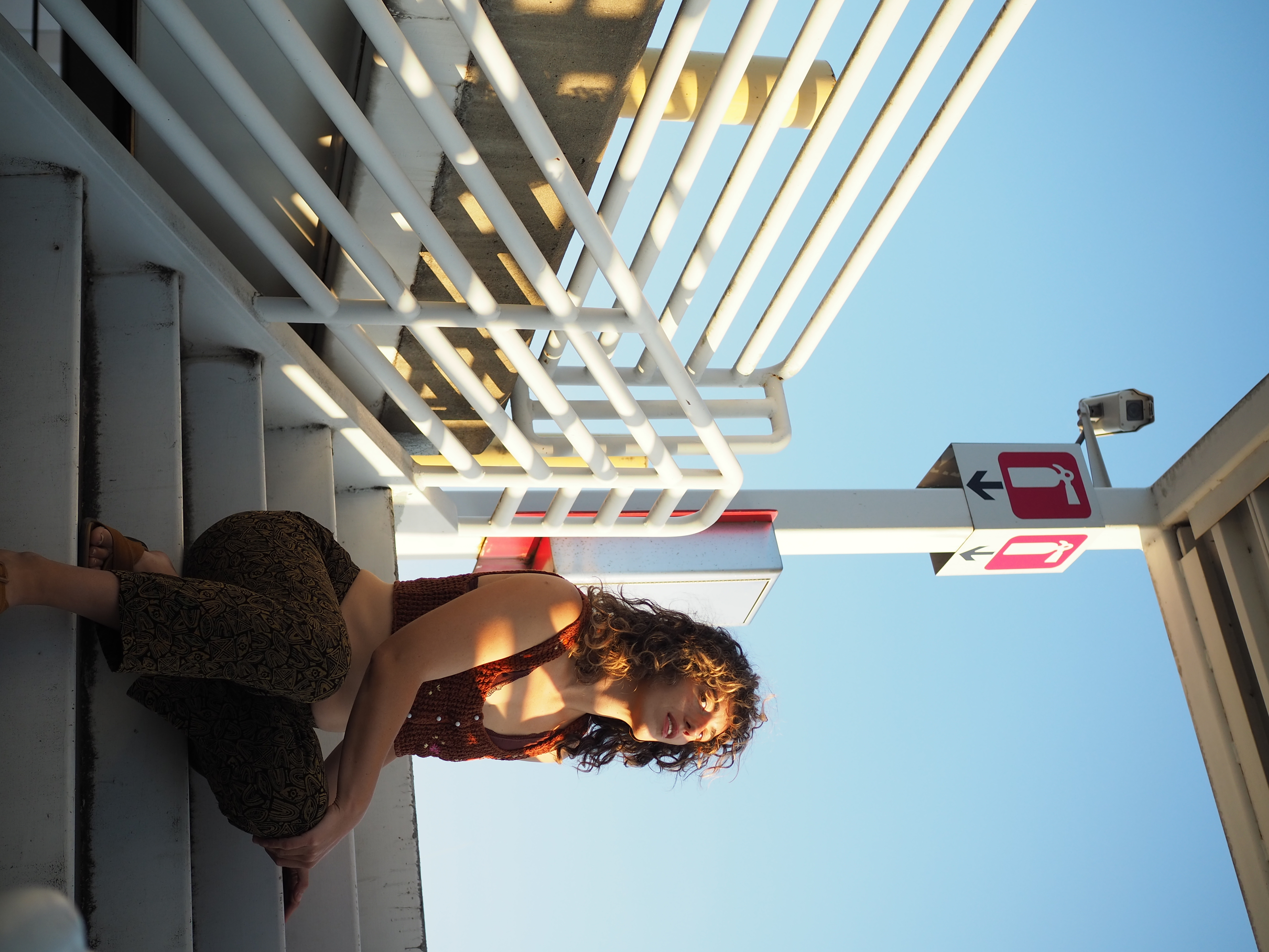 Lucy on sunlit airport steps